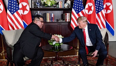 Trump_and_Kim_shaking_hands_in_the_summit_room