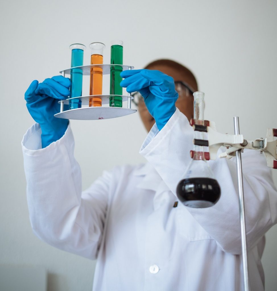 scientist holding vials